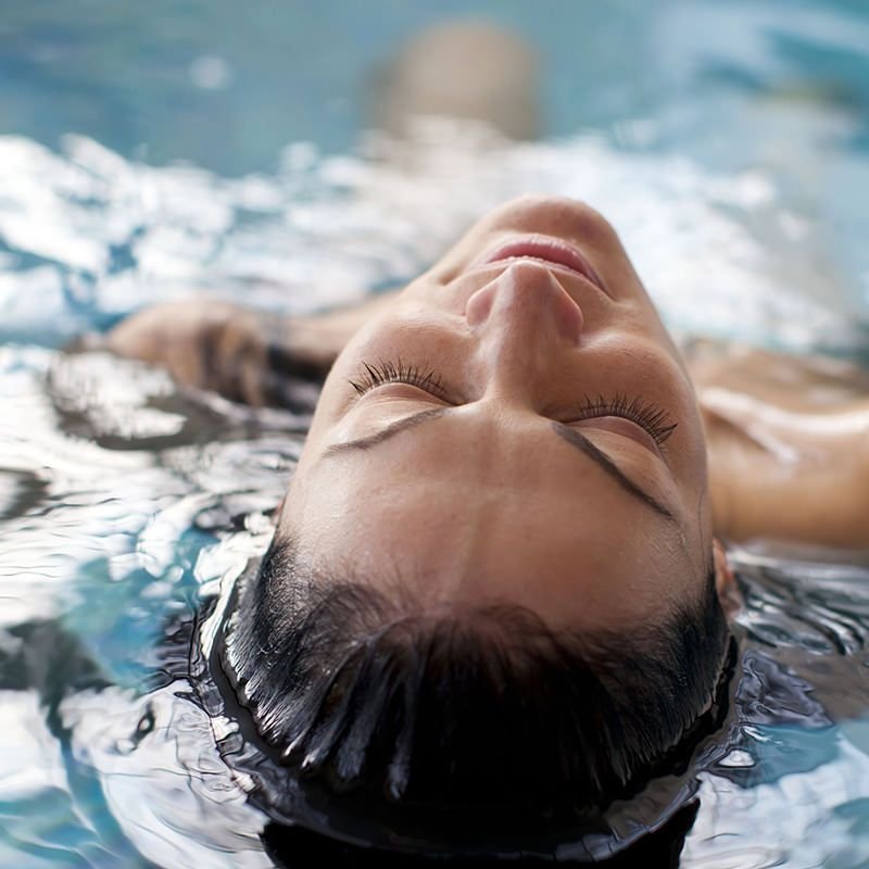 Person Laying in a Pool